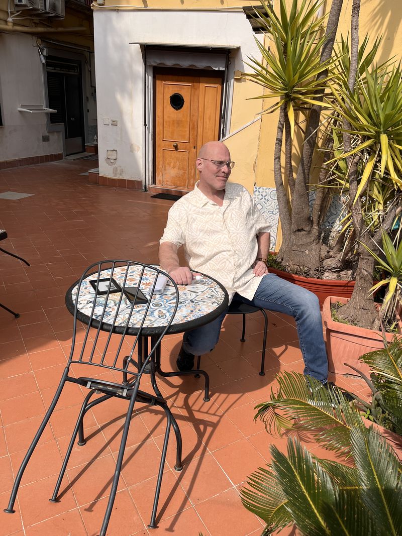 Marc tries out one of the tables in the March sunshine.