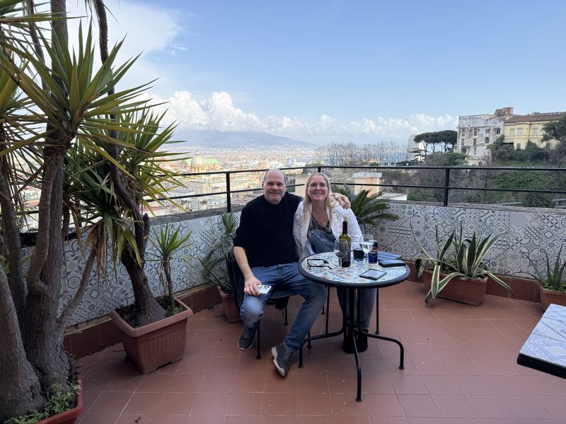 Liek and Bruno, our host, with a glass of wine on his terrace, looking out over the rooftops of Naples and Vesuvius in the distance.