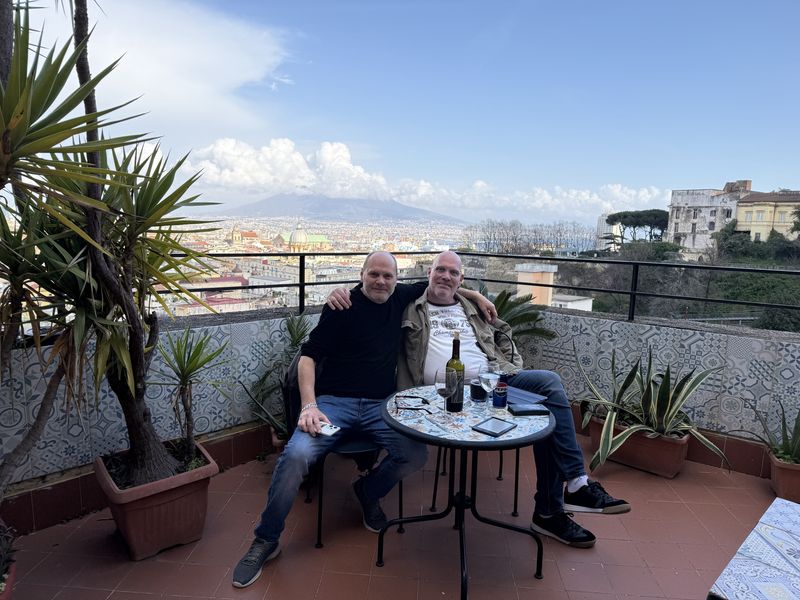 Marc and Bruno at the little table on the terrace. Behind us, the domes of the city and Vesuvius.