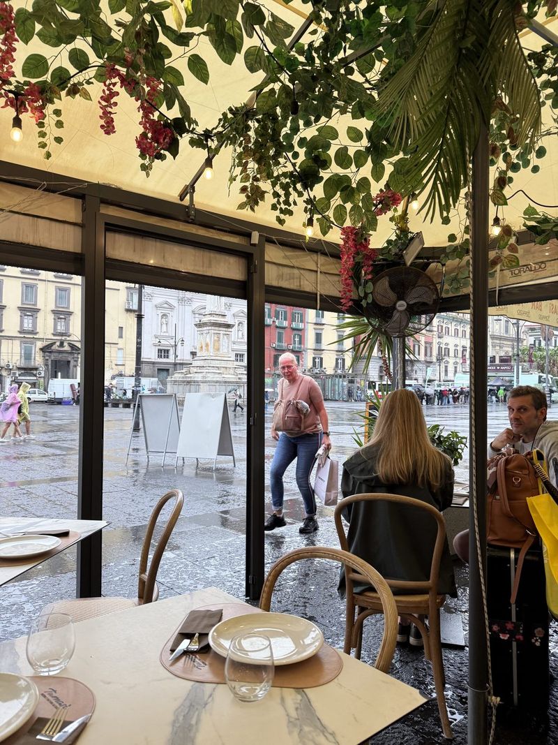 Back at Tumasi, with Piazza Dante still wet from the storm.