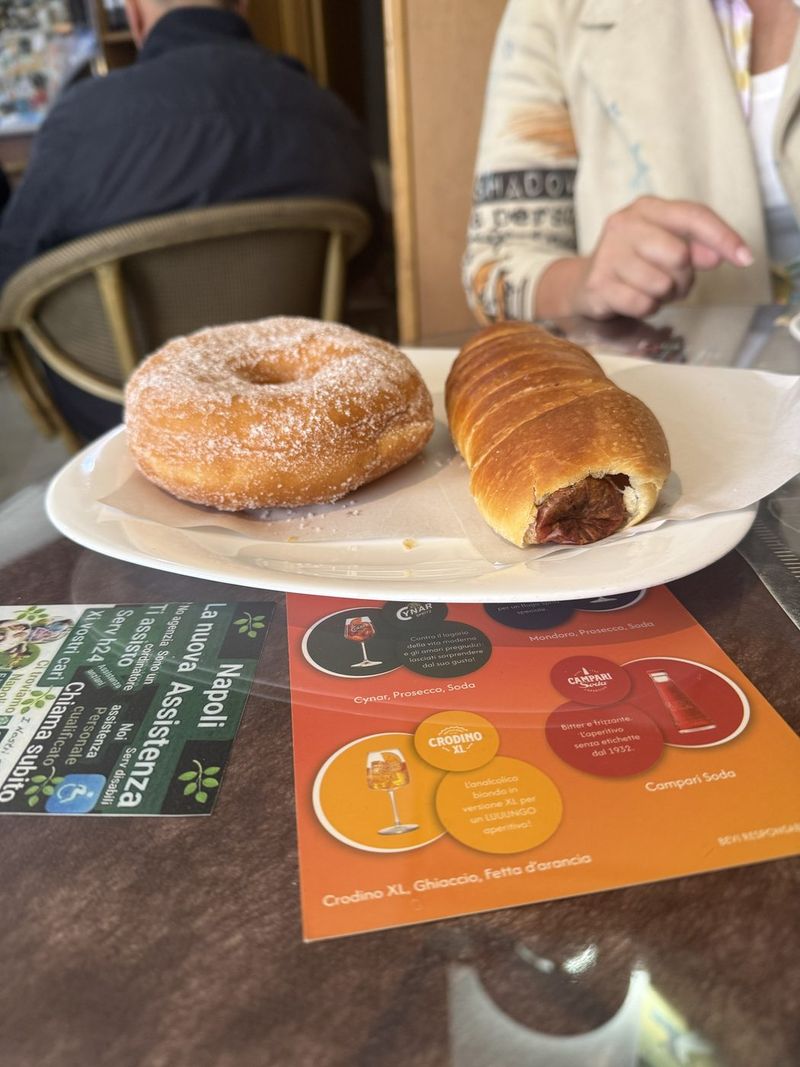 A graffa, the Neapolitan sugar doughnut, and a filled croissant.