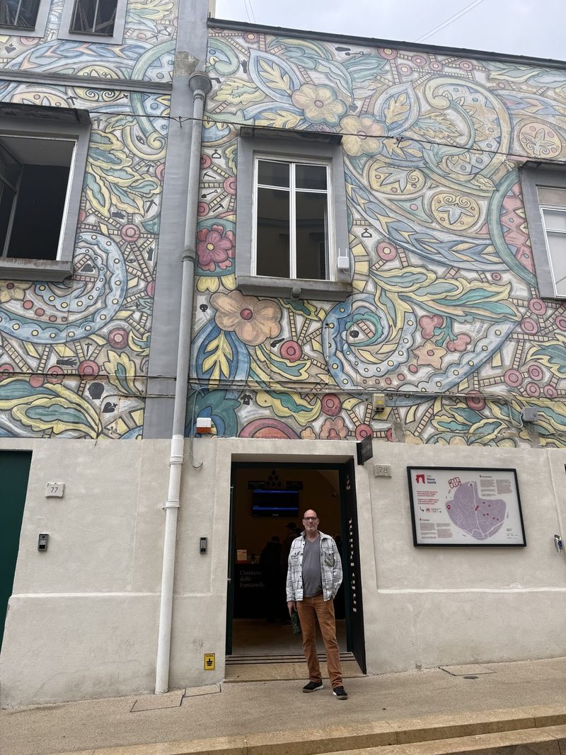 Marc at the painted entrance of the Cimitero delle Fontanelle.