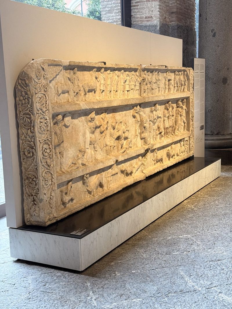 A large marble relief in the ground-floor gallery.