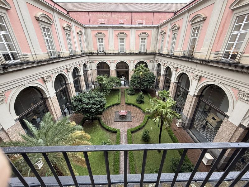 A view of one of the inner courtyards, with palm trees.