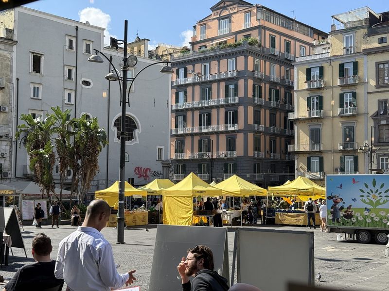 A market on Piazza Dante, in the sunshine.